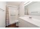 Modern bathroom featuring a tub, shower, and white vanity with a sink at 1050 S Monaco Pkwy # 77, Denver, CO 80224