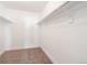 Walk-in closet with carpeted floors and ample shelving for storage at 1050 S Monaco Pkwy # 77, Denver, CO 80224