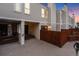 View of the building's exterior featuring siding, covered parking, and private outdoor area at 1050 S Monaco Pkwy # 77, Denver, CO 80224