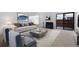 Bright living room with fireplace, sliding glass doors to patio, modern decor, and comfortable seating at 1050 S Monaco Pkwy # 77, Denver, CO 80224
