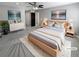 Staged main bedroom featuring a king size bed, dresser, and ceiling fan at 4020 S Atchison Way, Aurora, CO 80014