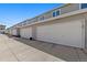 Row of well-maintained garage doors in an alleyway at 120 S Locust St, Denver, CO 80224