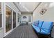 Charming patio features an outdoor seating area with a comfortable sofa and a table and chairs at 120 S Locust St, Denver, CO 80224