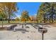 Community picnic area, features tables, bbq grill and concrete surroundings in a park setting at 120 S Locust St, Denver, CO 80224