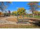 Scenic view of the community playground and park with vibrant autumn foliage at 120 S Locust St, Denver, CO 80224