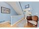 Entryway displaying a staircase and charming decor, with natural light and beautiful colors at 120 S Locust St, Denver, CO 80224