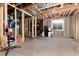 Spacious unfinished basement with visible beams, awaiting your personal touch at 1314 Ascot Ave, Highlands Ranch, CO 80126