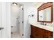 Bathroom featuring a classic vanity, neutral color palette, and bright lighting at 1314 Ascot Ave, Highlands Ranch, CO 80126