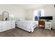 Bedroom with a desk area, bed, and ample natural light from a large window at 1314 Ascot Ave, Highlands Ranch, CO 80126