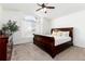 Cozy bedroom featuring a beautiful sleigh bed, decorative window, and a spacious closet at 1314 Ascot Ave, Highlands Ranch, CO 80126