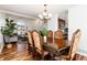 Elegant dining room with large wooden table and chairs, ideal for hosting dinner parties at 1314 Ascot Ave, Highlands Ranch, CO 80126