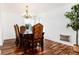 Elegant dining room with hardwood floors, a chandelier, and space for entertaining at 1314 Ascot Ave, Highlands Ranch, CO 80126