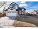 Charming two-story home with landscaped yard and inviting fire pit, perfect for outdoor entertaining at 1314 Ascot Ave, Highlands Ranch, CO 80126