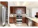 Well-appointed kitchen featuring stainless steel appliances and granite countertops at 1314 Ascot Ave, Highlands Ranch, CO 80126