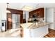 Modern kitchen with stainless steel appliances, granite countertops and ample cabinet space at 1314 Ascot Ave, Highlands Ranch, CO 80126