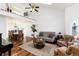 Cozy living room with high ceilings, a loft, hardwood floors, and ample natural light at 1314 Ascot Ave, Highlands Ranch, CO 80126