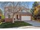 Charming two-story home with brick accents, a well-maintained lawn, and attached two car garage at 9457 Morning Glory Ln, Highlands Ranch, CO 80130