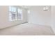 Well-lit bedroom featuring neutral carpet and windows at 2098 S Haleyville Way, Aurora, CO 80018