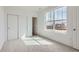 Bright bedroom with large window and closet with sliding doors at 2098 S Haleyville Way, Aurora, CO 80018