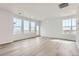 Bright living room with hardwood floors and large windows at 2098 S Haleyville Way, Aurora, CO 80018