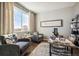 Inviting living area with comfortable seating, a large window, and a view at 6531 14Th St, Frederick, CO 80530