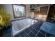 Bathroom with a jetted tub, tile floors and large window at 482 Spruce Creek Rd, Breckenridge, CO 80424