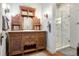 Beautiful bathroom with an antique vanity, marble countertop, and glass enclosed shower at 39 Pat Creek Rd, Evergreen, CO 80439
