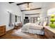 Charming bedroom with vaulted ceilings, exposed beams, fireplace, and access to the outdoors at 39 Pat Creek Rd, Evergreen, CO 80439
