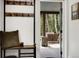 Welcoming entryway featuring a coat rack, storage bench, and a swing on the porch at 39 Pat Creek Rd, Evergreen, CO 80439