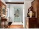Bright entryway features a decorative front door, hardwood floors, and classic furnishings at 39 Pat Creek Rd, Evergreen, CO 80439