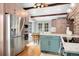 Well-equipped kitchen showcases stainless steel appliances, a center island, and a cozy dining area at 39 Pat Creek Rd, Evergreen, CO 80439