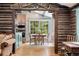 Charming eat-in kitchen with wood beams, stainless steel appliances, and view of the backyard at 39 Pat Creek Rd, Evergreen, CO 80439