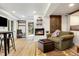 Inviting living room features a fireplace, lounge area and access to outdoor spaces at 39 Pat Creek Rd, Evergreen, CO 80439