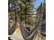 Relaxing porch featuring hanging hammocks and peaceful views of the surrounding woods at 39 Pat Creek Rd, Evergreen, CO 80439
