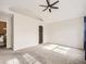 Bright bedroom featuring a vaulted ceiling, ceiling fan, and an entrance to an ensuite bathroom at 9813 E Carolina Pl, Aurora, CO 80247