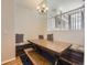 Charming dining area featuring built-in bench seating and stylish chandelier lighting at 9813 E Carolina Pl, Aurora, CO 80247