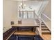 Bright dining room with a cozy bench, and a view of the staircase at 9813 E Carolina Pl, Aurora, CO 80247