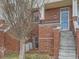 Charming brick townhouse featuring a welcoming entrance and a touch of classic American style at 9813 E Carolina Pl, Aurora, CO 80247