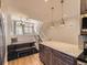 Open-concept kitchen with a granite island, stainless steel appliances, and adjacent dining area at 9813 E Carolina Pl, Aurora, CO 80247