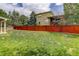 Lawn and fencing in a well-maintained backyard at 9996 Sedalia St, Commerce City, CO 80022