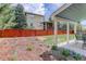 Backyard showcasing a lawn with a wooden fence at 9996 Sedalia St, Commerce City, CO 80022