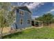 Blue home with a covered patio in a fenced yard at 9996 Sedalia St, Commerce City, CO 80022