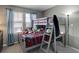 A bedroom includes bunkbeds and ample natural light at 9996 Sedalia St, Commerce City, CO 80022