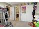 A bedroom includes a view of the bathroom, and plenty of floor space at 9996 Sedalia St, Commerce City, CO 80022