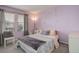 A bedroom features soothing colors, a view of the outdoors, and decorative accents at 9996 Sedalia St, Commerce City, CO 80022