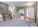 Spacious entryway featuring hardwood floors, a staircase, and ample natural light at 9996 Sedalia St, Commerce City, CO 80022