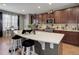Modern kitchen featuring a large island with bar seating, stainless steel appliances, and ample cabinet space at 9996 Sedalia St, Commerce City, CO 80022