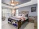 The spacious main bedroom has carpet floors and a trey ceiling at 9996 Sedalia St, Commerce City, CO 80022