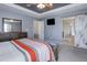 Large main bedroom has access to the main bathroom through a sliding barn door at 9996 Sedalia St, Commerce City, CO 80022
