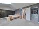 Bright bedroom featuring wood accents, a skylight, and an open closet at 36545 Winchester Rd, Elizabeth, CO 80107